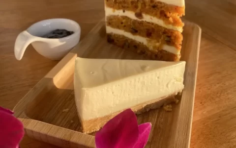 Carrot cake and a cheesecake with a small bowl of blueberry jam. The best dessert in Rawai at Poached Breakfast Cafe Rawai, Phuket, Thailand