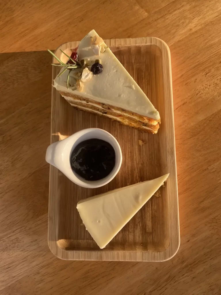 Spiced carrot cake with dried fruit, a blueberry compote and cheesecake at the spot with the best omelette near Nai Harn, Poached Breakfast Cafe Rawai, Phuket, Thailand